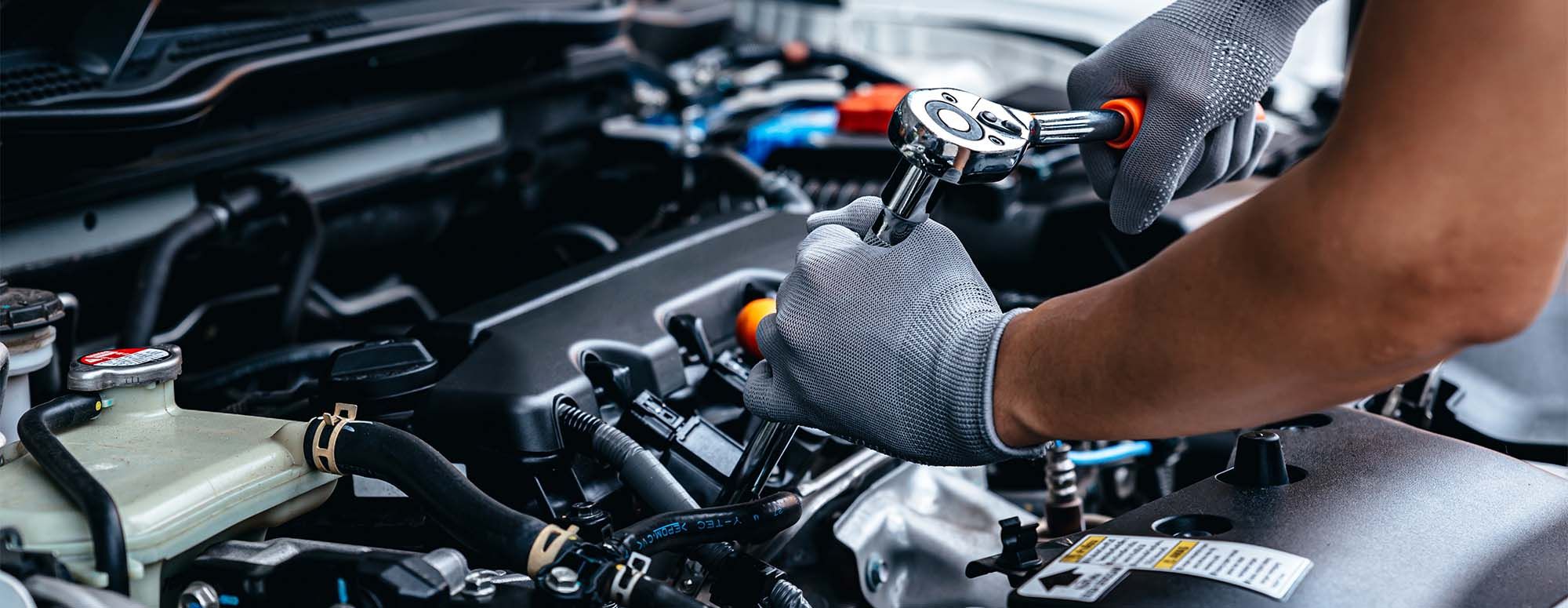 Changing oil in a car.